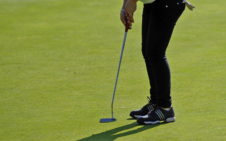 Ramstein&#39;s Elizabeth Ward follows her putt on the ninth hole on opening day of the DODDS-Europe golf championships at Wiesbaden&#39;s Rheinblick golf course on Thursday.