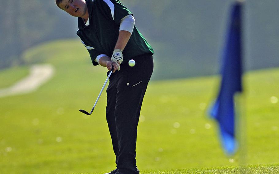 SHAPE&#39;s Joe Broughton chips onto the ninth green on opening day of the DODDS-Europe golf championships at Wiesbaden&#39;s Rheinblick golf course on Thursday.