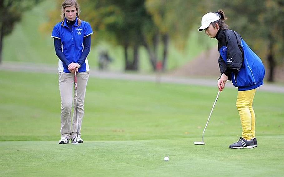 Ramstein's Elizabeth Ward, right, putts on the 18th hole on the final day of the 2010 DODDS-Europe golf championships in Wiesbaden, on Friday. Ward, the 2008 champion, took the girls title, scoring 62 modified Stableford points to beat out defending champion Hollie Salvo of Wiesbaden, left, and Vilseck freshman Lauren Zachar.
