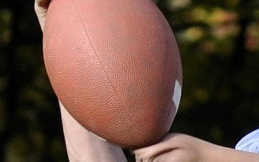 Anthony Coltson, 15, a tight end and wide receiver for the Patch junior varsity football team, uses a unique technique to pull in passes during a practice sesssion on Patch Barracks.