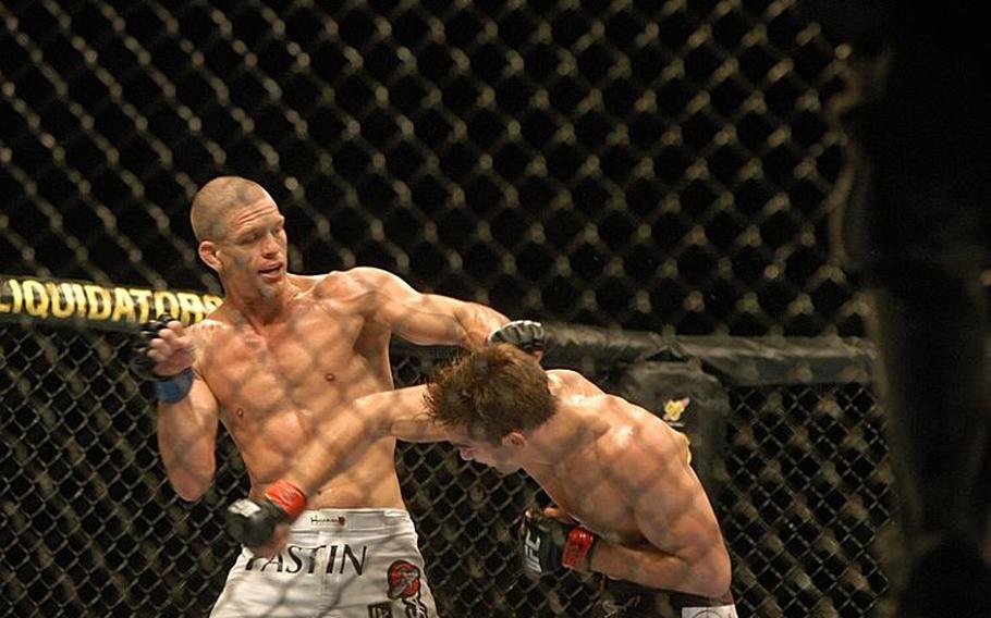 American fighter Mike ''Quicksand'' Pyle, left, counters with a punch against British fighter John ''The Hitman'' Hathaway at UFC 120 held in London on Oct. 16. Pyle defeated Hathaway by unanimous decision.