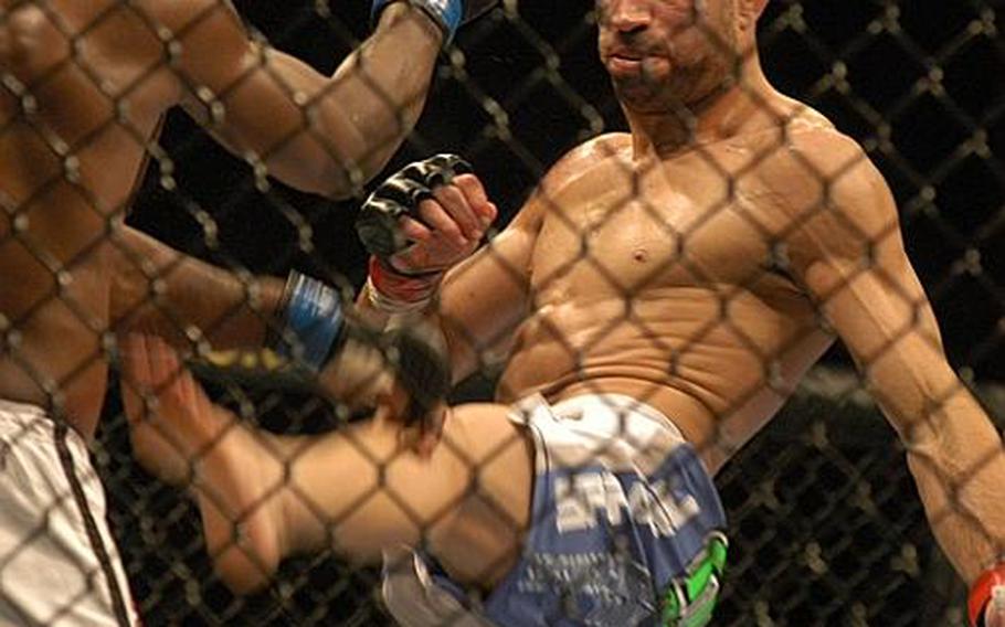 British fighter James ''Lightning'' Wilks attempts to kick his opponent, Canadian Claude ''The Prince'' Patrick, during UFC 120 held Oct. 16 in London. Patrick won the fight by a unanimous decision.