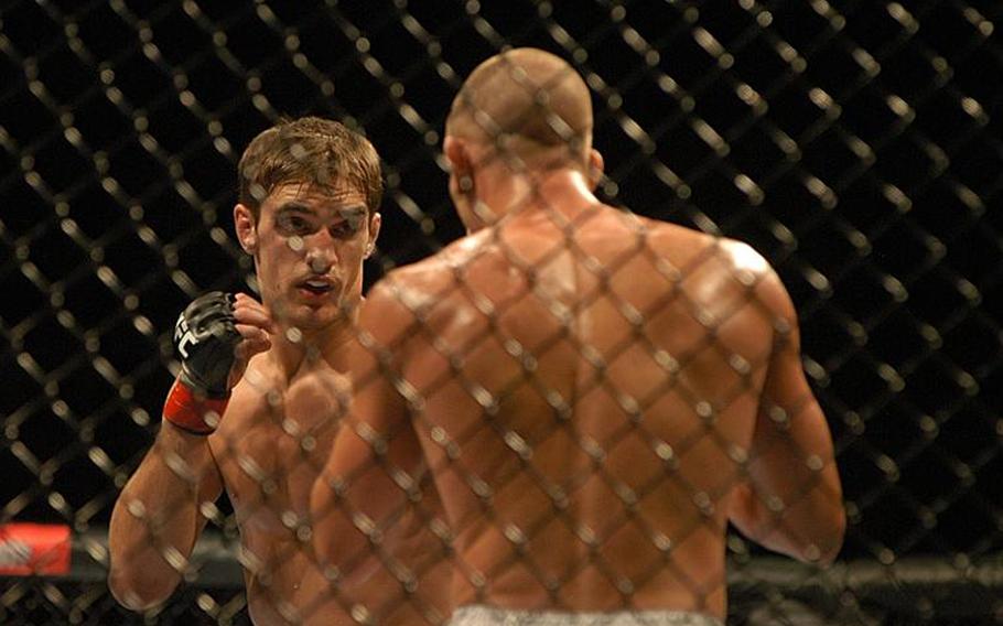 Up-and-coming British fighter John ''The Hitman'' Hathaway, left, squared off against American Mike ''Quicksand'' Pyle during the Ultimate Fighting Championship 120 event  in London on Oct. 16. Pyle won the fight in a unanimous decision.