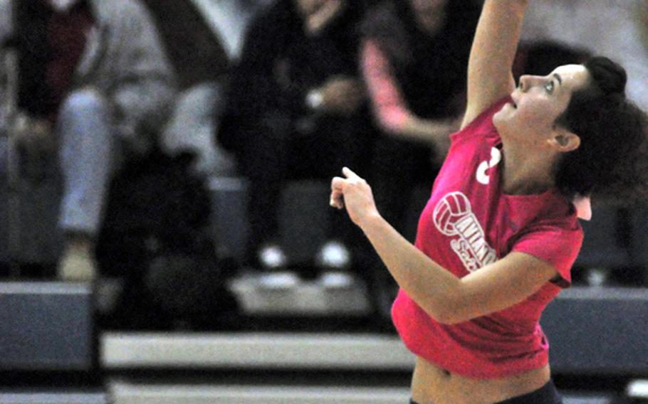 Aviano sophomore AnnMarie McClelland connects for a point from the second row in the Saints' 25-13, 25-15, 26-24 victory Saturday over Marymount International. Aviano players sported pink T-shirts and matching ribbons in their hair in support of breast cancer awareness in what has become an annual event.