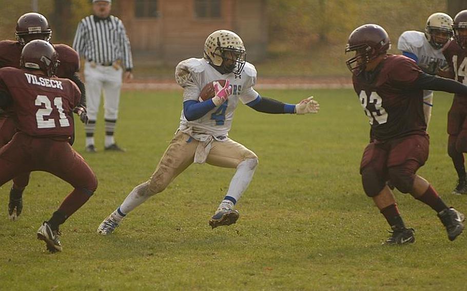 Wiesbaden junior Daniel Harris cuts up field Saturday during the Warriors' 28-21 win over Vilseck. Harris rushed scored all four of the Warriors' touchdowns in the comeback victory.