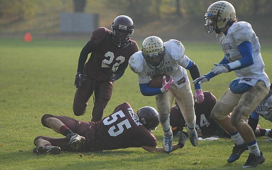 Wiesbaden junior Daniel Harris drives up field Saturday during the Warriors' 28-21 win over Vilseck. Harris rushed for 219 yards on 25 carries and scored all four of the Warriors' touchdowns.