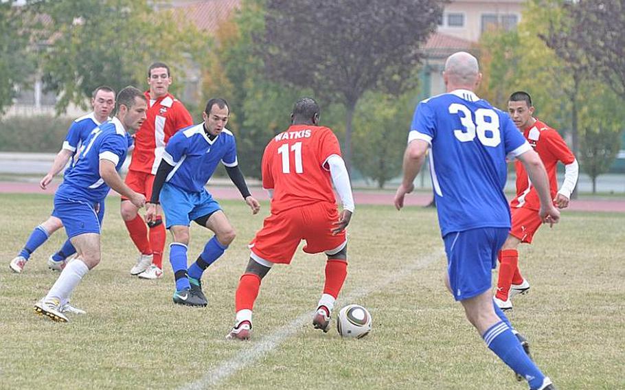 Lakenheath defenders quickly close in on Aviano&#39;s Rojet Wakis during first half action Sunday of the championship game of the U.S. Forces-Europe Soccer Championship. Aviano, which lost in the finals last year, won this time with a 2-1 victory over Lakenheath.