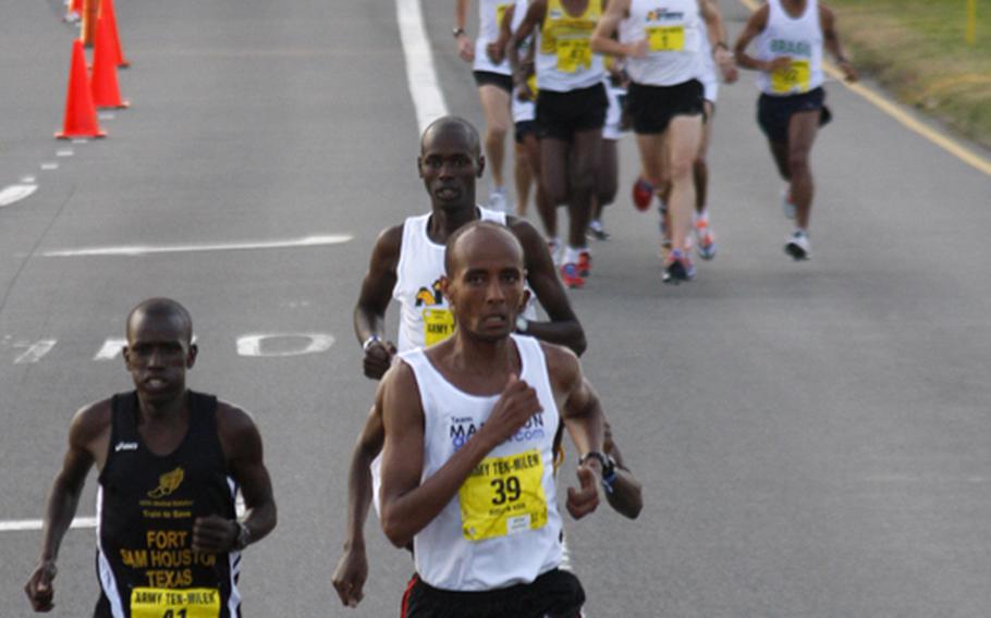 Joseph Chirlee (41) and Alene Reta (39) lead the field in the early stages of the Ten-Miler. Reta soon pulled ahead to a lead he would never give up, while Chirlee finished eighth.