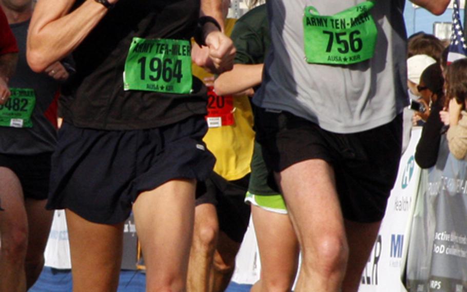 Lise Willingham of Earlysville, Va., and Chris Samley of Charlottesville, Va., finish with a burst of speed.