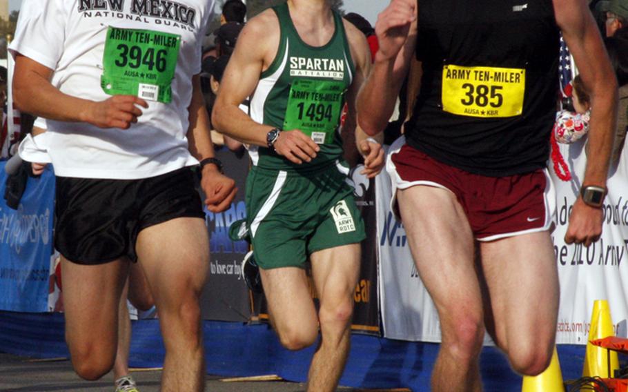 Jacobo Hernendez of Los Lunas, N.M. (3946), Sean Kincaid of Okemos, Mich. (1494), and Kyle Guglielmo of Virginia Beach, Va., sprint toward the finish line.