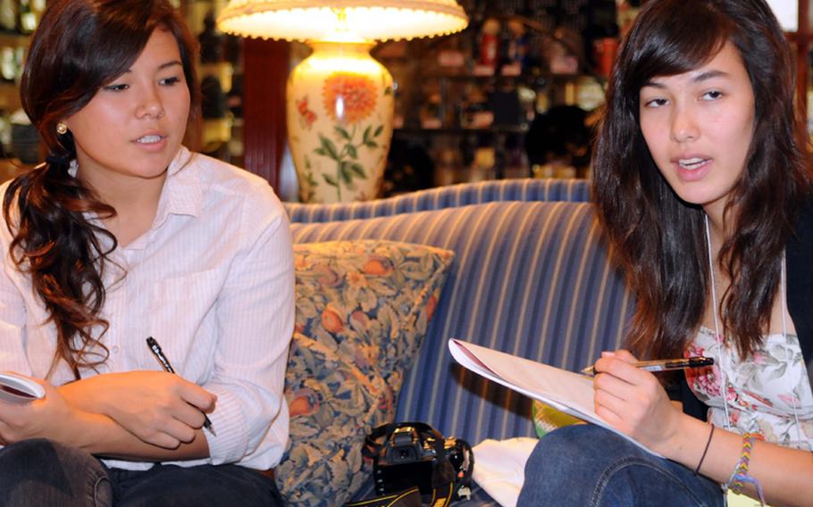 Seoul American senior Katie Darby and Daegu American senior Michelle Fox discuss story options for their six-person news team during Monday's initial budget meeting in the 2010 DODDS-Pacific Far East Journalism Conference at Tokyo's New Sanno Hotel. Darby is a softball pitcher and Fox a soccer midfielder; their respective Far East tournaments take place at the same time as the Far East Film and Entertainment Arts Festival in May in Seoul, an example of how DODDS Pacific's expanding Far East Activities Calendar gives students more options and opportunities than many would  have in the States.