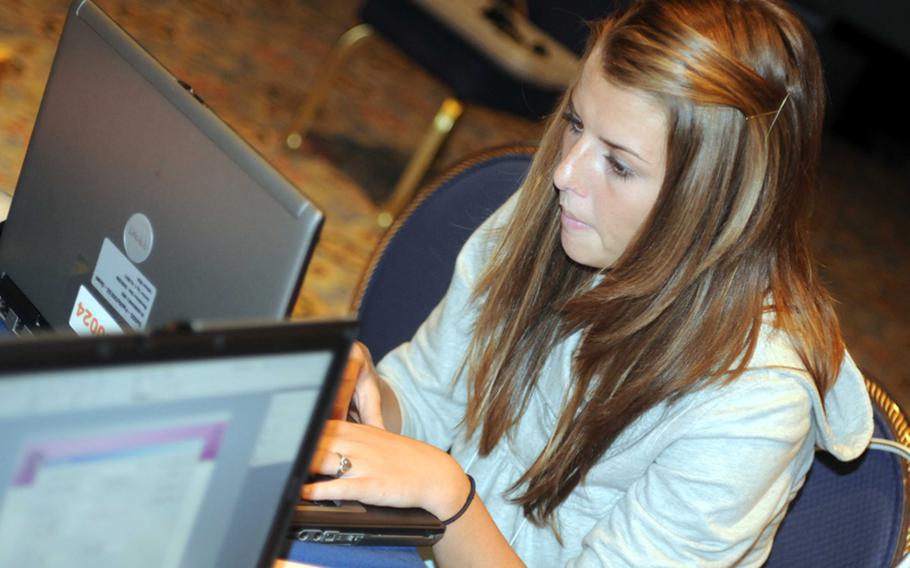 Guam High sophomore Meagan Speck processes material for her six-person news team during Monday's photography session in the 2010 DODDS-Pacific Far East Journalism Conference at Tokyo's New Sanno Hotel. Speck is also a soccer player and cross country runner, and missed her team's first two matches of the Independent Interscholastic Athletic Association of Guam season, and is also in training for next month's Far East cross-country meet in Japan. She's an example of how DODDS Pacific's expanding Far East Activities Calendar gives students more options and opportunities than theyd have in the States.