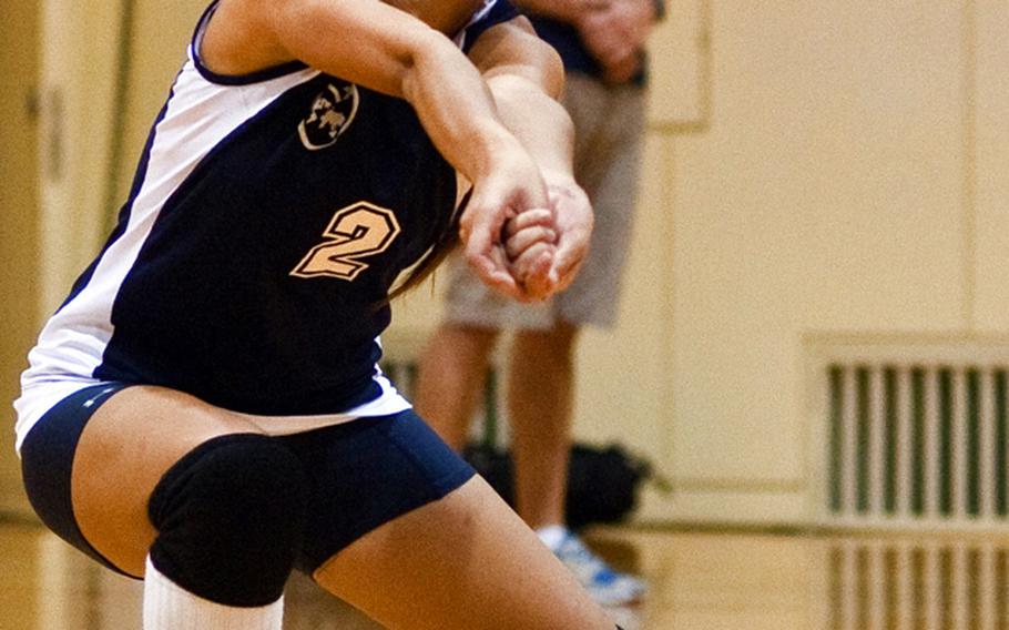 International School of the Sacred Heart's Nako Chung digs up a Christian Academy Japan shot during Tuesday's Kanto Plain Association of Secondary Schools girls volleyball match at University of Sacred Heart gymnasium, Tokyo. CAJ won 20-25, 25-15, 25-18, 25-17. 
Alpuerto is one of 111 students attending this week's DODDS-Pacific Far East High School Journalism Conference in Tokyo; this photo was taken at the conference's annual sports writing and photography challenge.