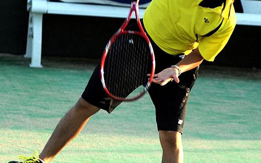 Max Negami of American School In Japan follows through on a serve against Kent Sikama of St. Mary's International during Wednesday's Kanto Plain Association of Secondary Schools tennis tournament at Shirako Tennis Club, Shirako, Chiba Prefecture, Japan. Negami got the victory, and with it the boys singles title, at 3-2 in the first set when Sikama retired with leg cramps.