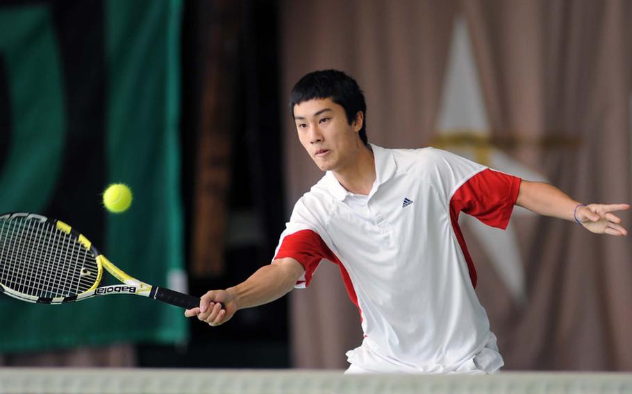 Patrick Tan of ISB concentrates as he returns a shot from Patch's Jon Lightner in their quarterfinal match at the DODDS-Europe tennis tournament  in Wiesbaden, Germany, on Friday. Tan, the tourney's second seed, beat the seventh-seeded Lightner 6-3, 6-4.