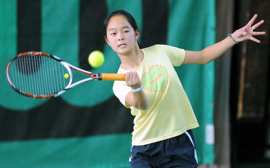 Fourth-seeded Sayaks Goto of Iinternational School of brussels uses her forehand to return a shot by Bitburg's Kaitlyn Miller. Goto won the quarterfinal match at the DODDS-Europe tennis finals in Wiesbaden, Germany, on Friday, 6-1, 7-5.