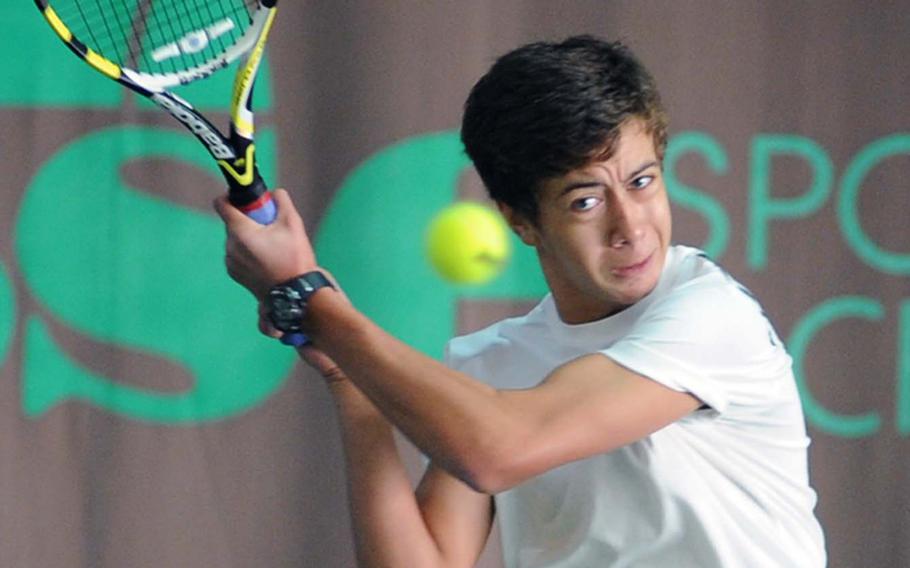 Heidelberg's Cameron Meeker knocks back a shot from Bahrain's Emir Isik in their quarterfinal match at the DODDS-Europe tennis tournament in Wiesbaden, Germany, on Friday. The fifth-seeded Meeker beat Isik, the tourney's fourth seed 6-4, 7-6 (7-2).