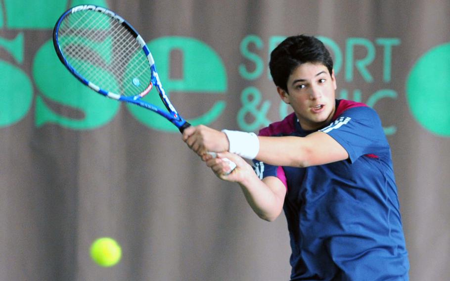 Bahrain's Emir Isik, the tourney's fourth seed, returns a Cameron Meeker shot in his 4-6, 6-7 (2-7) quarterfinal loss to the fifth-seeded Heidelberg player during the DODDS-Europe tennis tournament tennis finals in Wiesbaden, Germany, on Friday.
