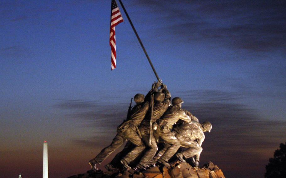 The Marine Corps Memorial, the Washington Monument and the Capitol provided some impressive pre-dawn scenery for runners in the Marine Corps Marathon, which started and finished near the famed monument to the World War II flag raising on Iwo Jima.