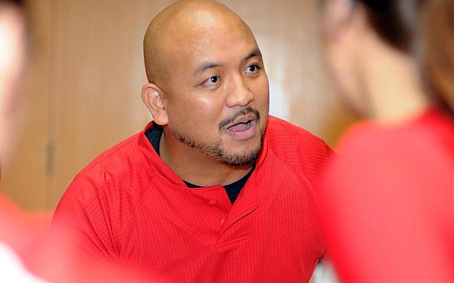 Nile C. Kinnick Red Devils coach Al Garrido gives instructions to his charges during a timeout against the American School In Japan Mustangs during Thursday's Kanto Plain Association of Secondary Schools girls volleyball match at Mustang Valley, ASIJ's Chofu campus in western Tokyo. Kinnick won in four sets, 25-11, 25-21, 23-25, 25-16.