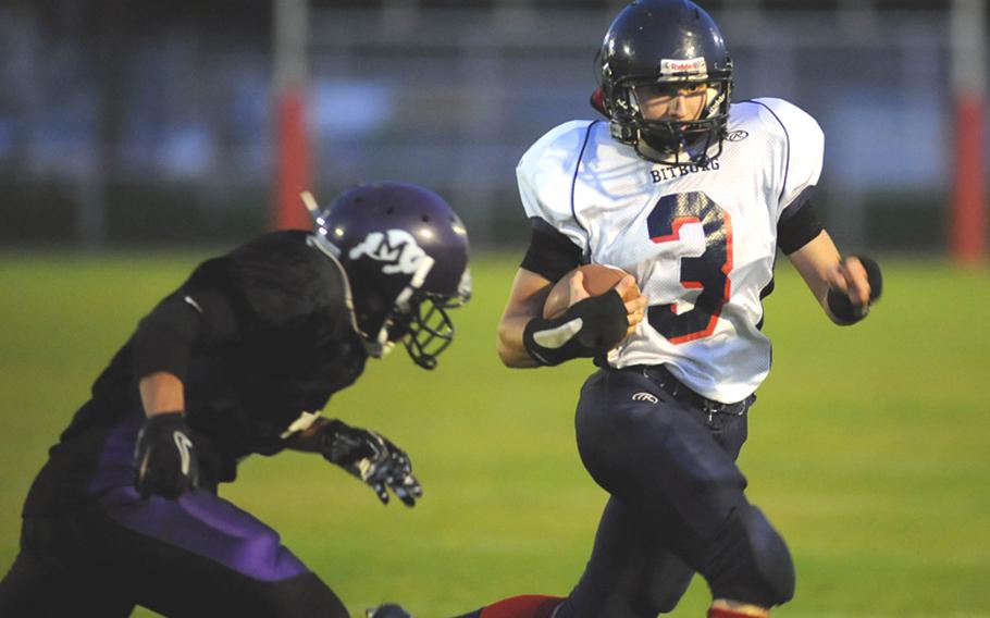 Mannheim's Calvin Baisden, left, closes in on Bitburg's Aaron Mayfield after Mayfield rushed for a big gain in the Barons' 21-6 win over over Mannheim on Oct. 8. The two teams meet again Saturday in the Division II title game.