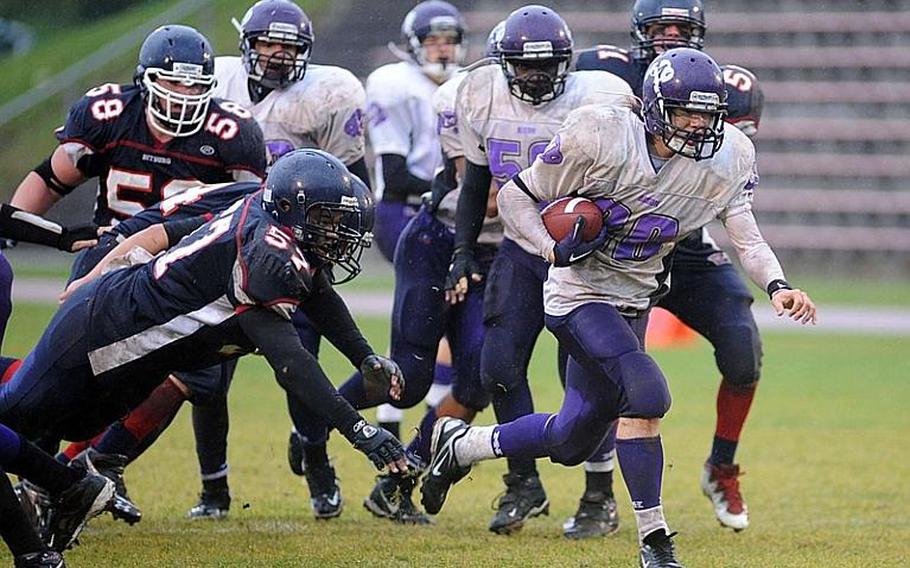 Mannheim's Jacob Lankford slips a tackle and gets away from the Bitburg defense in Mannheim's 34-7 loss to the Barons in the Division II title game in Baumholder on Saturday