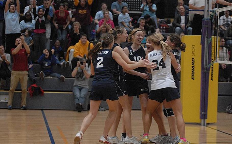 The Black Forest Academy volleyball team celebrates after capturing the DODDS-Europe Division II championship Saturday at Ramstein Air Base with a 25-15,25-20, 25-17 win against Mannheim.