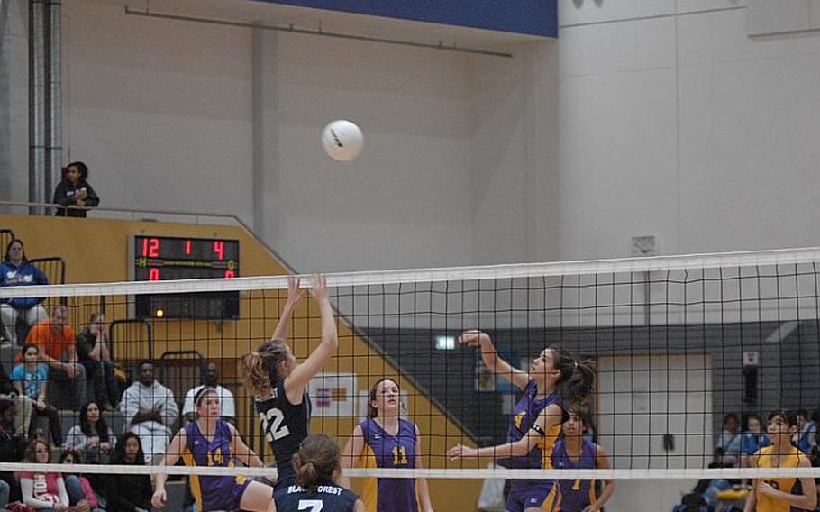 Black Forest Academy senior Kate Woodward tries to get to the ball sent over by Mannheim's Asia Bliss during the DODDS-Europe girls Division II volleyball championships at Ramstein Air Base.  BFA won to repeat as division champs.