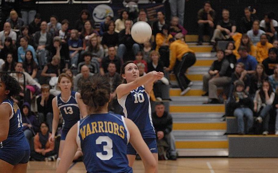 Wiesbaden junior Andrea Arnold lobs the ball towards the net during Saturday's DODDS-Europe Division I girls volleyball championship at Ramstein Air Base.  The Warriors fell in three straight sets to Vilseck.