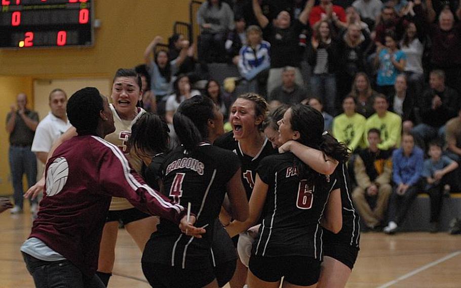 The Vilseck Falcons volleyball team celebrates after winning the Division I title Saturday at Ramstein Air Base.  Vilseck beat the Warriors in straight sets to win the top prize.