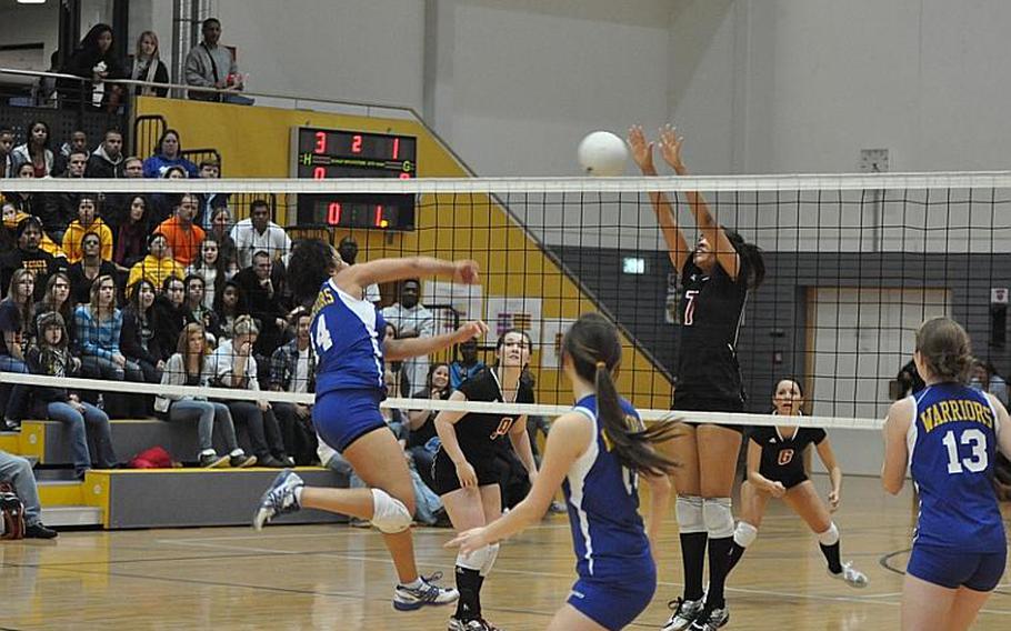 Wiesbaden senior LeAmber Thomas tries to drill a power shot past the arms of junior Sidni Beaulieu of Vilseck.  Wiesbaden fell to Vilseck during the Division I championship match at the  DODDS-Europe girls volleyball championships at Ramstein Air Base.