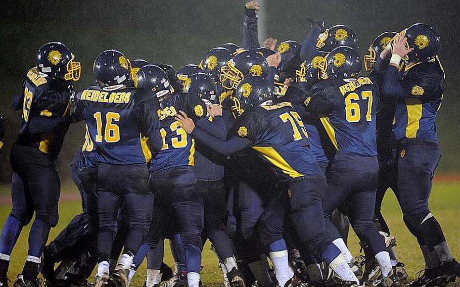 The Heidelberg Lions celebrate their 23-20 overtime win against Wiesbaden in the Division I title game in Baumholder, on Saturday night.