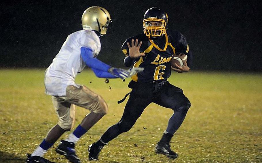 Heidelberg's Sterling Jones, right, rushes against Wiesbaden's Khari Bennett in the Division I final in Baumholder on Saturday. Heidelberg won a thriller in overtime, 23-20, to take the title.