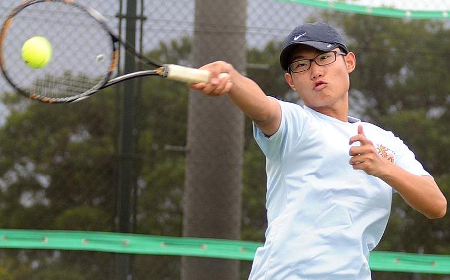 Seoul American's Chong Lee rips a forehand return to Kody Botts of Matthew C. Perry during Monday's first-round boys singles match in the Far East High School Tennis Tournament at Risner Tennis Complex, Kadena Air Base, Okinawa. Lee beat Botts 8-2.