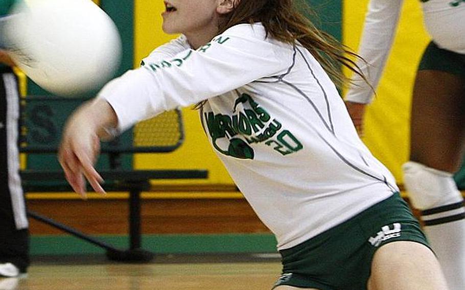 Daegu American senior Kristina Bergman digs a Morrison Christian Academy spike during Tuesday's pool-play match in the Far East High School Girls Division II Volleyball Tournament at Eagles Nest, Robert D. Edgren High School, Misawa Air Base, Japan. Defending champion Daegu won the second set, 25-20, after dropping the first set, 25-23.