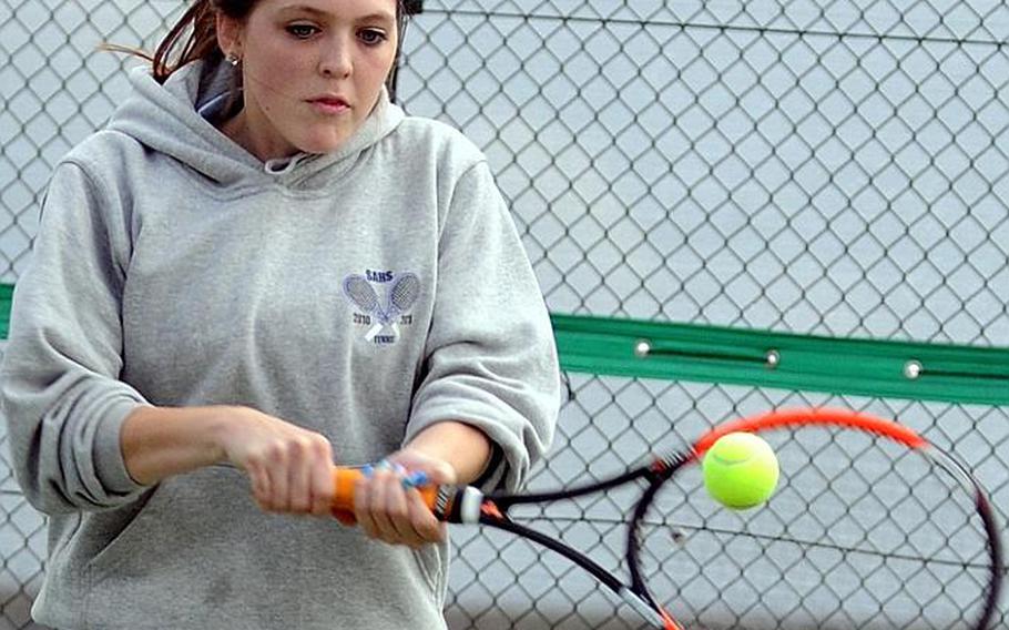 Seoul American's Carson Allen smashes a backhand return during Tuesday's girls doubles match in the Far East High School Tennis Tournament at Risner Tennis Complex, Kadena Air Base, Okinawa. Allen and her partner Kirsten Kwon lost 8-1 to Amber and Chloe Gadsden of Guam High.