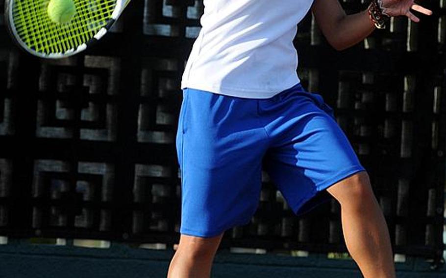 Yokota's Erika Ettl smashes a forehand return to Kadena's Christin Gentz during Tuesday's girls singles quarterfinal match in the Far East High School Tennis Tournament at Risner Tennis Complex, Kadena Air Base, Okinawa. Ettl won 8-4 to advance to Wednesday's semifinals.