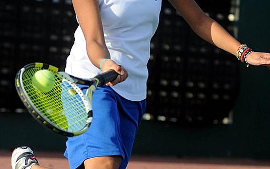 Yokota's Erika Ettl prepares a drop shot against Kadena's Christin Gentz during Tuesday's girls singles quarterfinal match in the Far East High School Tennis Tournament at Risner Tennis Complex, Kadena Air Base, Okinawa. Ettl won 8-4 to advance to Wednesday's semifinals.