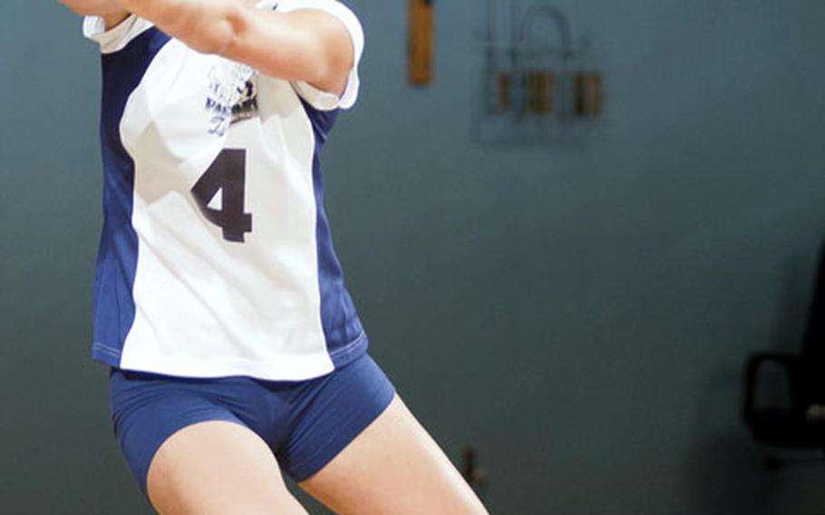 Seoul American defensive specialist Hannah Swafford digs up a Christian Academy Japan spike during Wednesday's quarterfinal match in the Far East High School Girls Division I Volleyball Tournament at Falcon Gym, Seoul American High School, South Post, Yongsan Garrison, South Korea. Seoul American dethroned the defending champion Knights 25-15, 25-21.