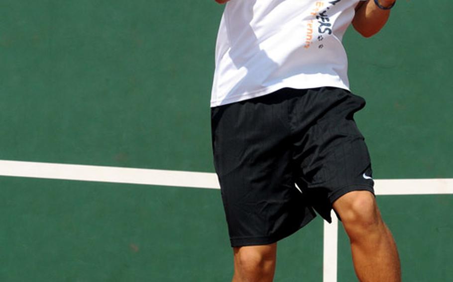 Kadena Panthers junior Arlo Taylor slams a forehand return against Russell Midomaru of Seoul American during Wednesday's boys singles semifinal match in the Far East High School Tennis Tournament at Risner Tennis Complex, Kadena Air Base, Okinawa. Taylor was trailing 2-6, 5-5, 40-0 in the second set when Midomaru retired due to heat exhaustion.