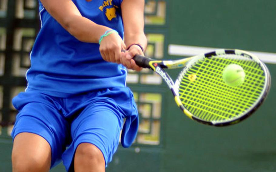 Yokota Panthers junior Erika Ettl chases down a backhand return against Kadena Panthers sophomore and former Yokota teammate Erika Youngdahl during Wednesday's  girls singles semifinal match in the Far East High School Tennis Tournament at Risner Tennis Complex, Kadena Air Base, Okinawa. Ettl won 6-2, 6-4.