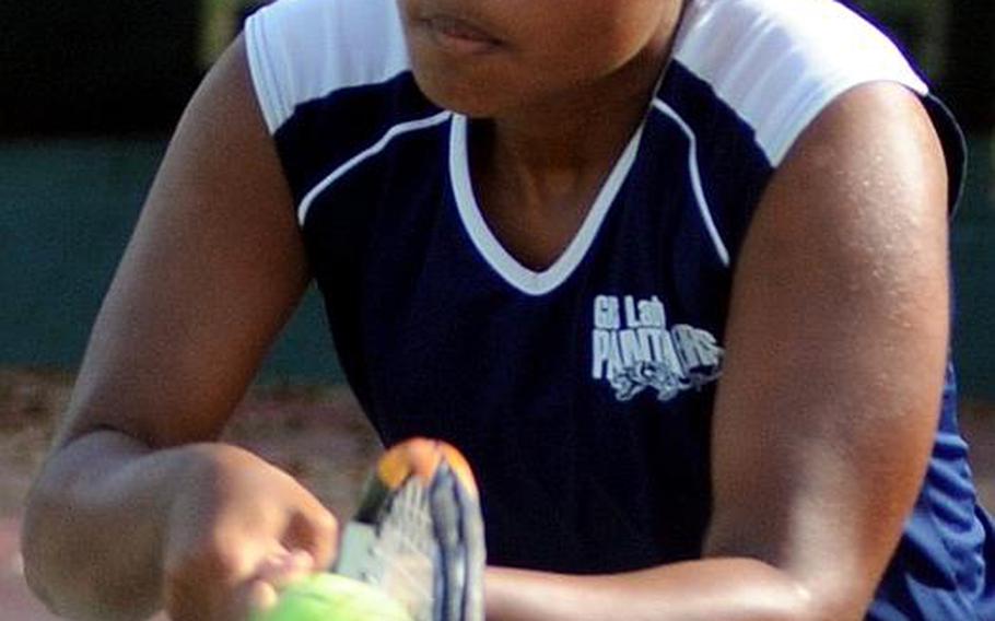 Guam High senior Amber Gadsden sends a backhand return to Yokota junior Erika Ettl during Thursday's girls singles championship in the Far East High School Tennis Tournament at Risner Tennis Complex, Kadena Air Base, Okinawa. Gadsden rallied from behind 3-5 in the first set to overtake Ettl 7-6 (7-4), 6-2.