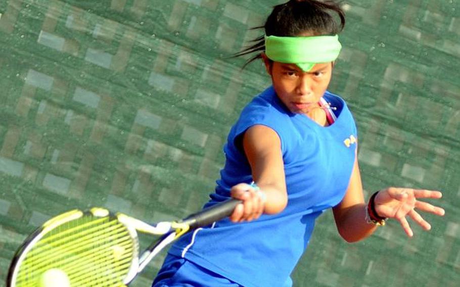 Yokota junior Erika Ettl fires a forehand volley against Guam High senior Amber Gadsden during Thursday's girls singles championship in the Far East High School Tennis Tournament at Risner Tennis Complex, Kadena Air Base, Okinawa. Gadsden rallied from behind 3-5 in the first set to overtake Ettl 7-6 (7-4), 6-2.