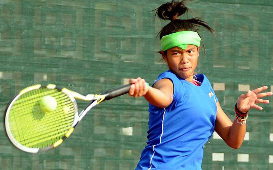 Yokota junior Erika Ettl slams a forehand return against Guam High senior Amber Gadsden during Thursday's girls singles championship in the Far East High School Tennis Tournament at Risner Tennis Complex, Kadena Air Base, Okinawa. Gadsden rallied from behind 3-5 in the first set to overtake Ettl 7-6 (7-4), 6-2.