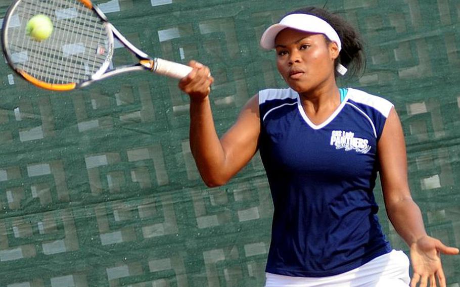 Guam High senior Amber Gadsden sends a forehand return to Yokota junior Erika Ettl during Thursdays girls singles championship in the Far East High School Tennis Tournament at Risner Tennis Complex, Kadena Air Base, Okinawa. Gadsden rallied from behind 3-5 in the first set to overtake Ettl 7-6 (7-4), 6-2.