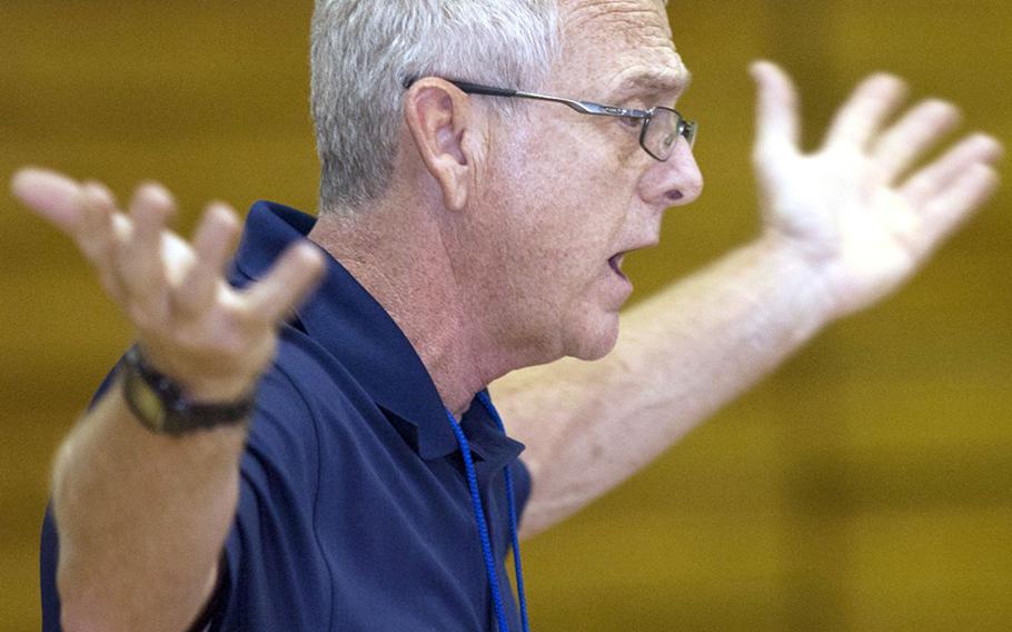 Denny Hilgar, the 31-year head coach of Seoul American&#39;s girls volleyball team, gestures to his players during a match. His 2010 team sent him off with the perfect ending to his coaching career, his first and only Far East Division I Tournament title.