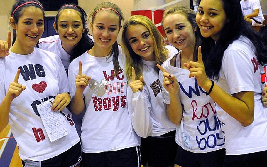 Singapore American Eagles girls players Kerry Remson, Tayla Marsh, Hannah Goode, Alex McConaghy, Monica Scieszka and Celeste Marsh show off their "We Love Our Boys" shirts during the 41st Hong Kong International School Holiday Basketball Tournament at Hong Kong International School, Red Hill Road, Tai Tam, Hong Kong.