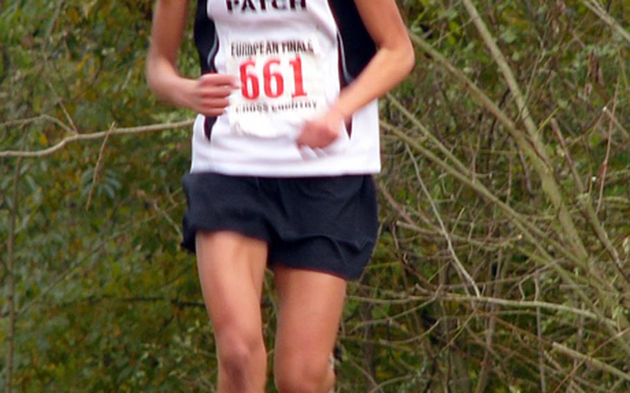 Patch sophomore Morgan Mahlock is all alone as she heads over a small rise in the course en route to her win in the 2010 European championship. She was selected as Stars and Stripes' girls cross country runner of the year.