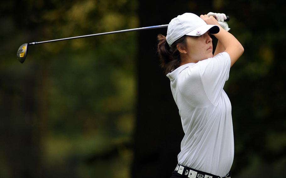 Ramstein's Elizabeth Ward follows the flight of the ball after teeing off during a 2010 golf tournament at Woodlawn Golf Course on Ramstein Air Base. Ward was selected as the Stars and Stripes girls golfer of the year in Europe.