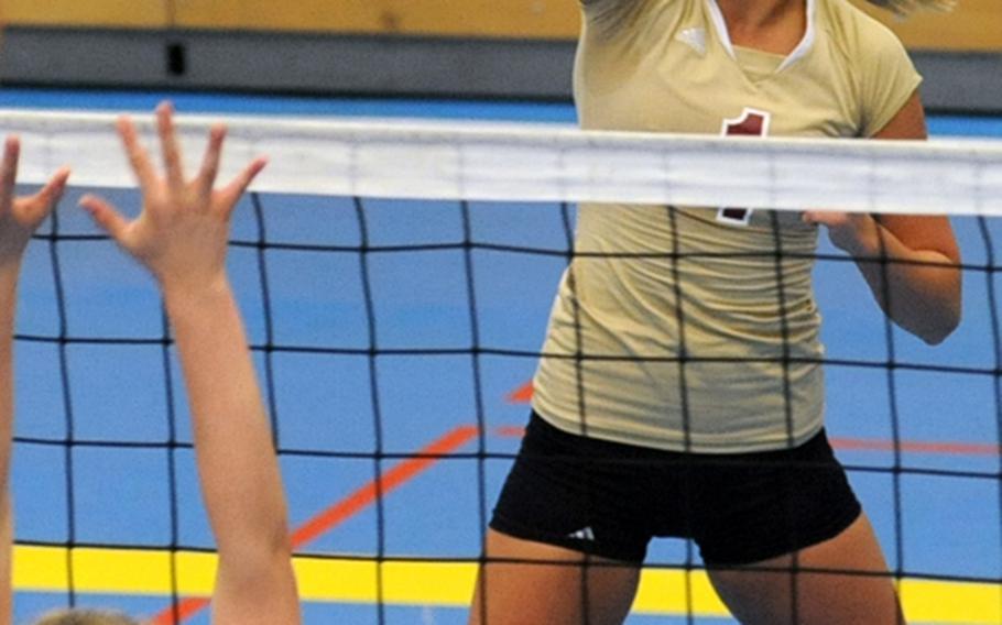 Vilseck's Anna Muzzy slams the ball over the net during a 2010 match against  Heidelberg. Muzzy was named the Stars and Stripes' volleyball player of the year for Europe.